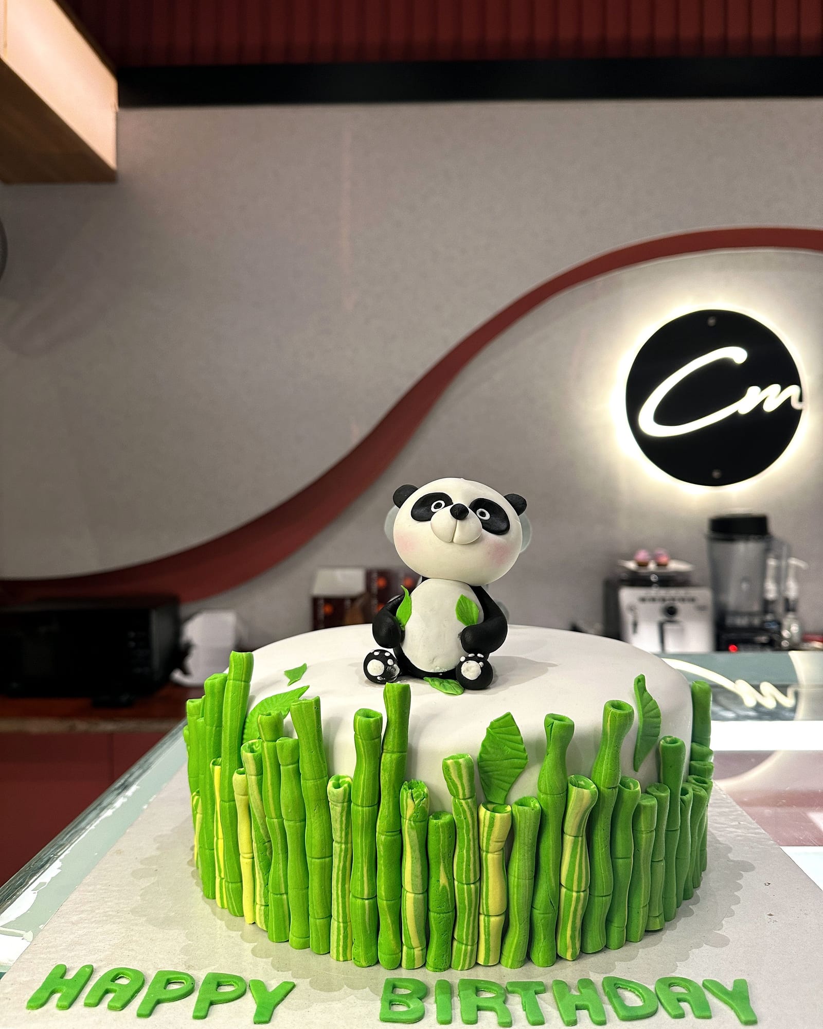 Panda and bamboo fondant birthday cake