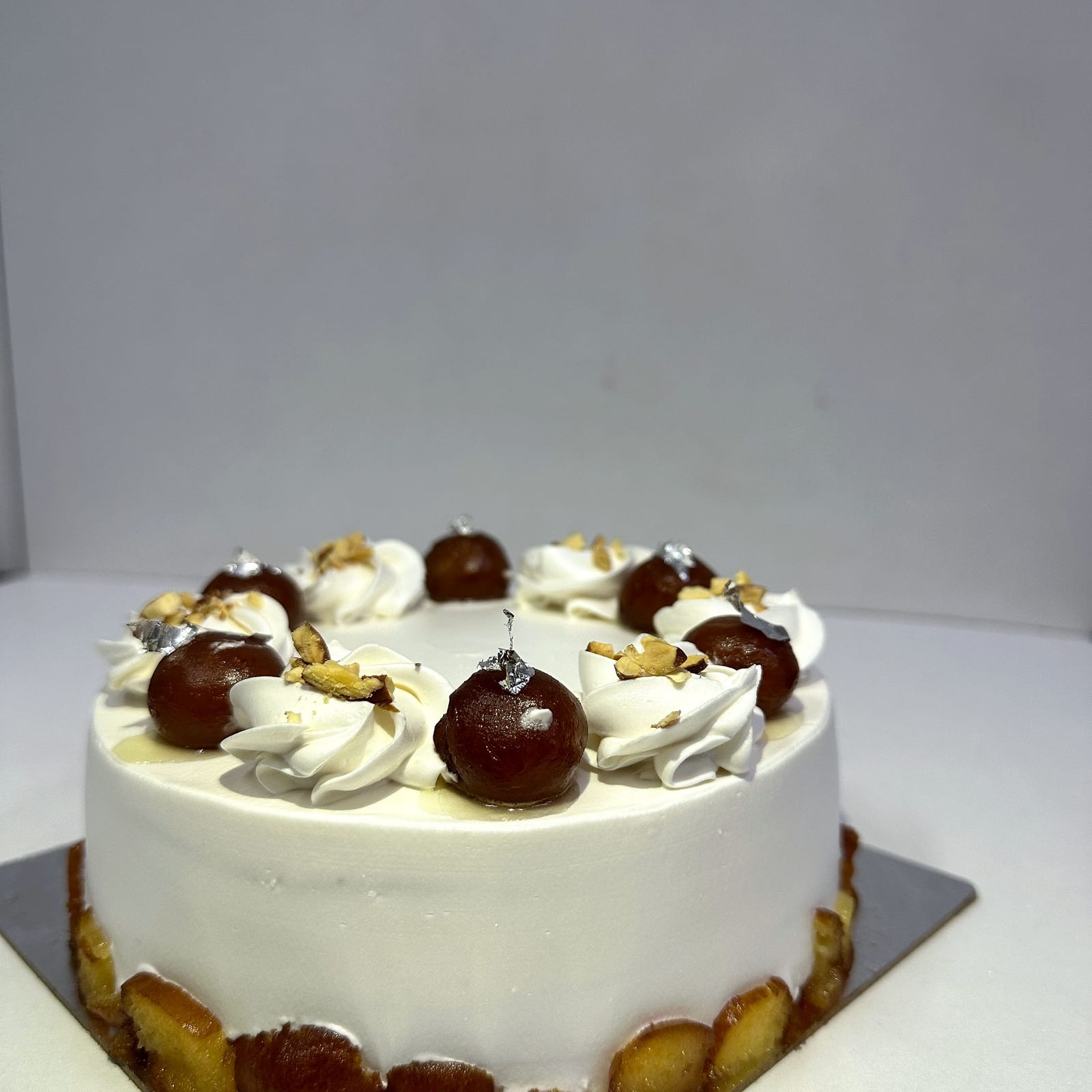 Gulab jamun cake — vanilla sponge topped with syrup-soaked jamuns