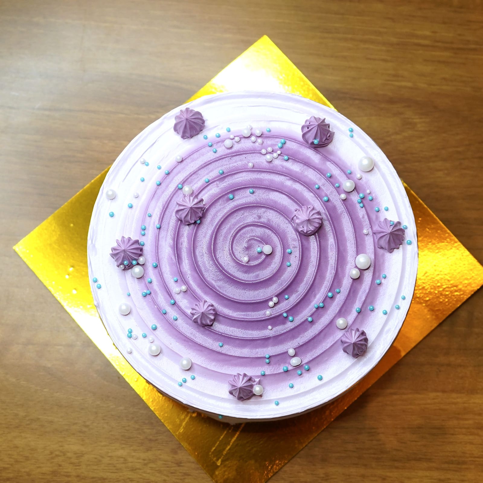 A blueberry cream cake photographed from above