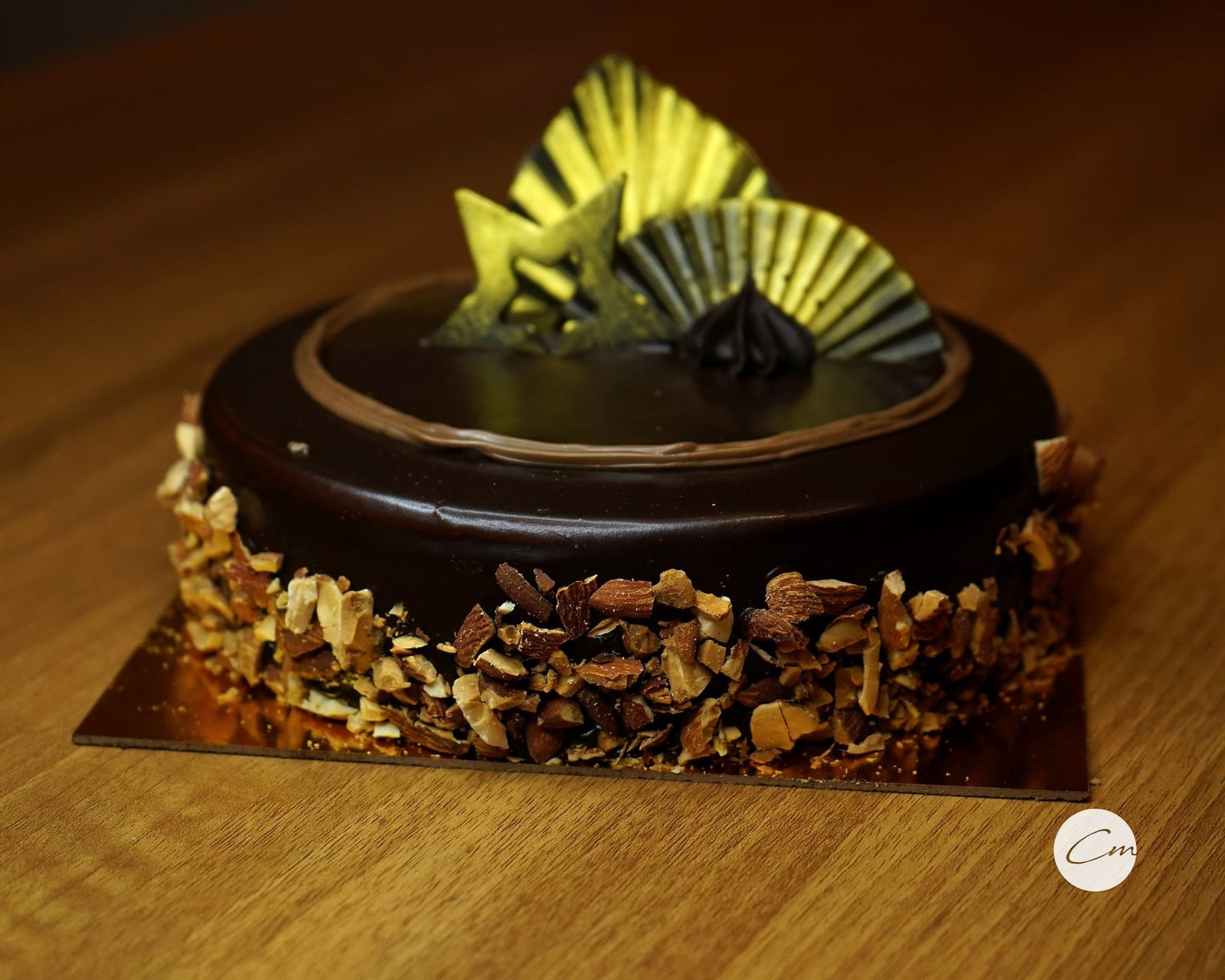 A whole Hazelnut Almond cake, roasted almonds pressed into the sides