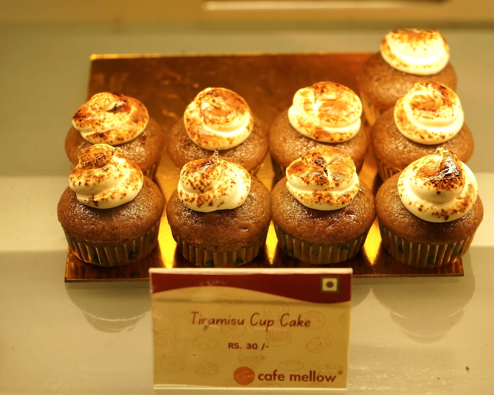 Tiramisu cupcakes dusted with cocoa