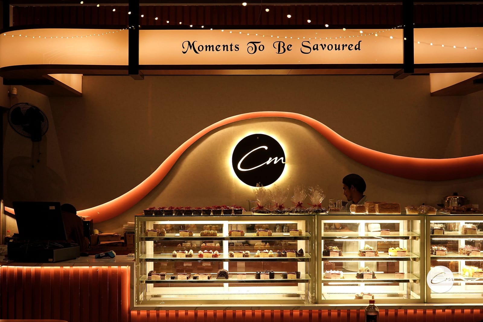 The dessert counter and wave wall at Café Mellow