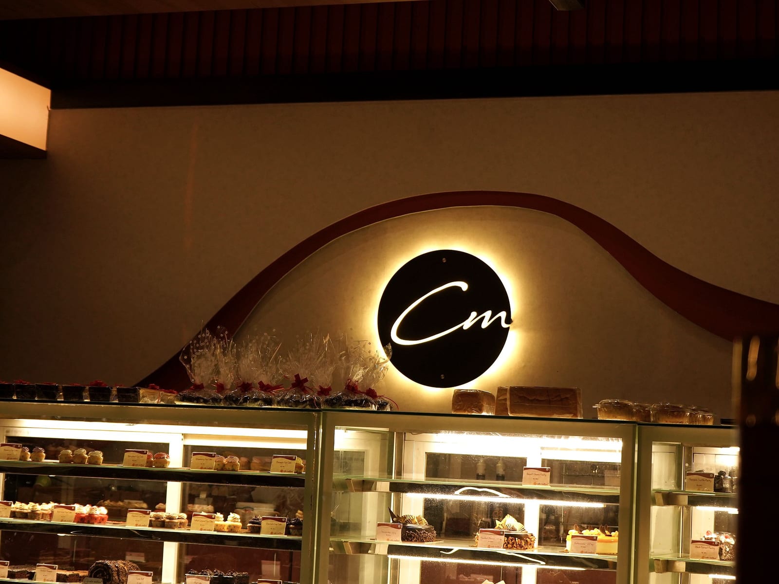 Chilled display cases of eggless pastries at Café Mellow
