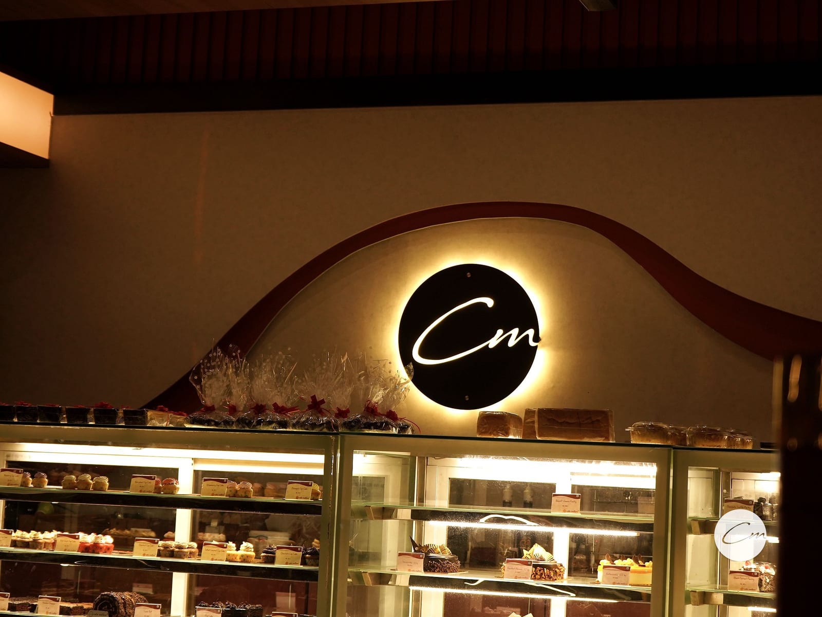 Chilled display cases of eggless pastries at Café Mellow