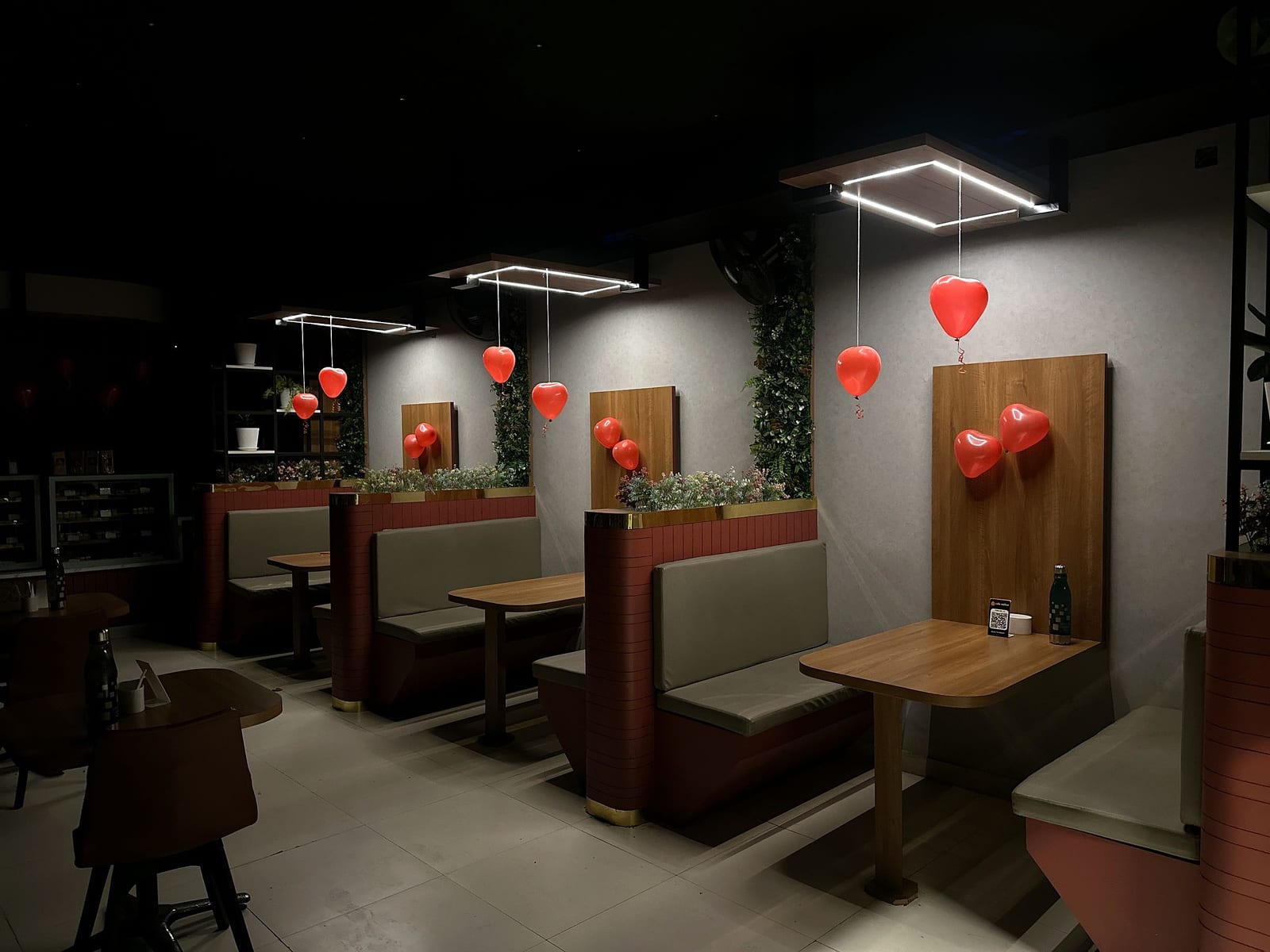 The banquette booths and wooden tables at Café Mellow