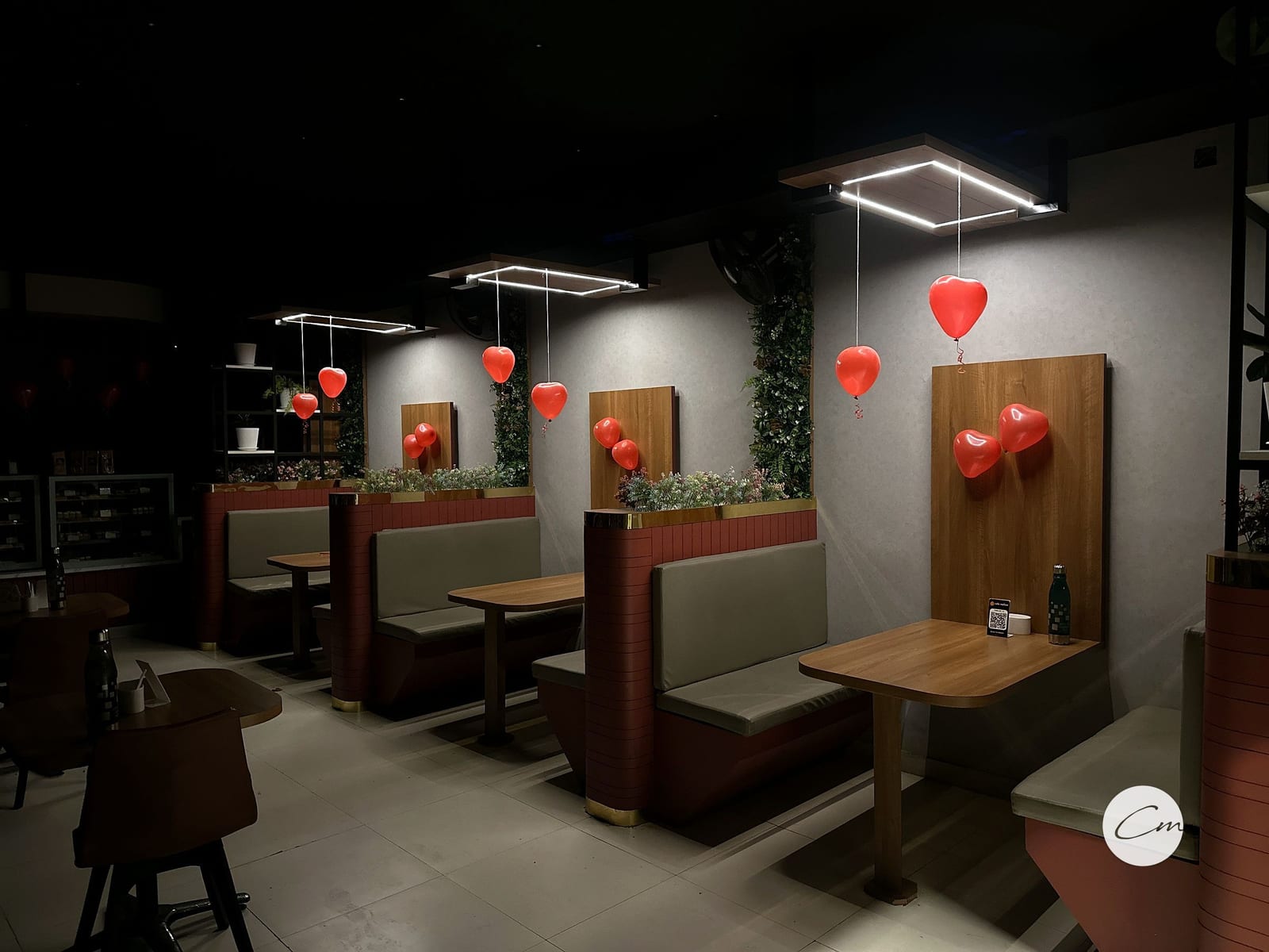 The banquette booths and wooden tables at Café Mellow